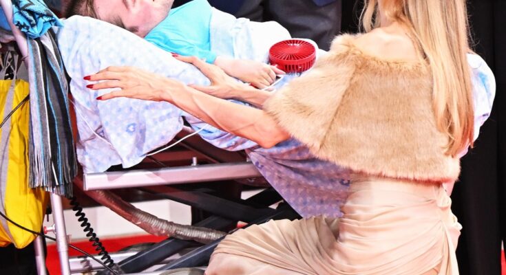 Angelina Jolie KNEELS ON THE GROUND as she shares a special moment with a BED-RIDDEN FAN on the red carpet of the 81st Venice International Film Festival. Moments before the premiere of her film “Maria,” the actress left the public emotional with this wholesome moment. 