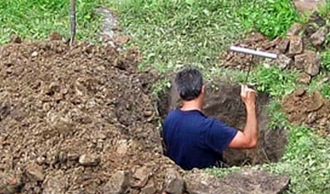 A man started digging in the backyard, and when the neighbors saw what he was doing, they right away phoned the police.